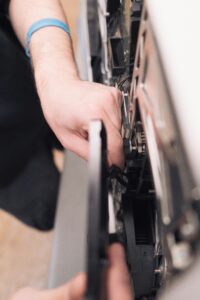 Specialist technician servicing a Viking built-in refrigerator